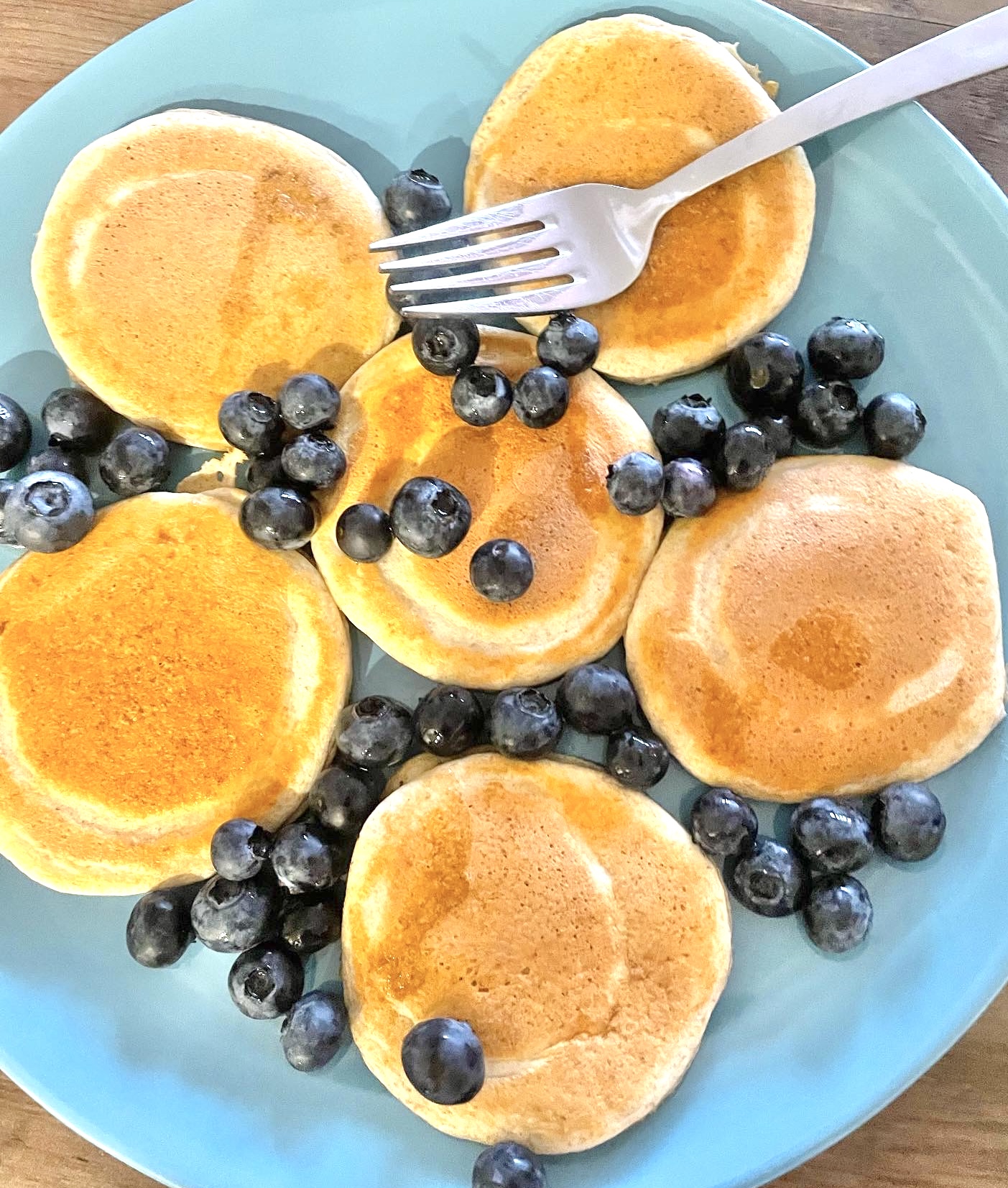 pancakes and blueberries on a plate